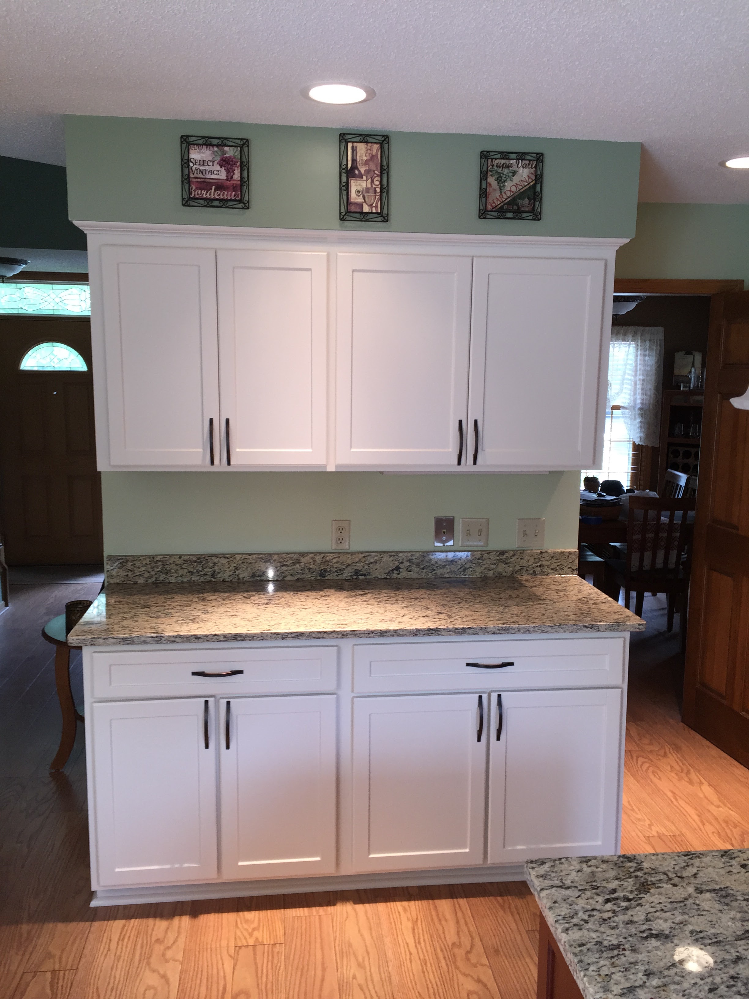 AFTER - Beautiful newly refaced cabinets in a modern, easy-to-clean and maintain White finish