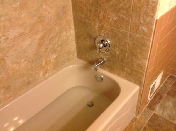 AFTER - New Acrylic Surround in Capri Granite 12 x 12 Slate pattern with Sandbar bathtub