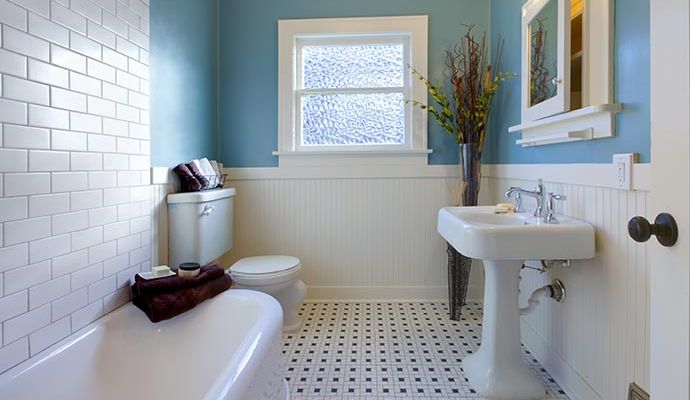 Newly remodeled basement bathroom with modern design Renovated basement bathroom with fresh tile and window installation