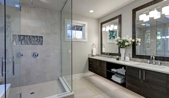 Remodeled bathroom with elegant vanity and shower area Stylish modern bathroom with a sleek vanity and shower area