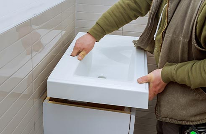 Professional expert installing vanity