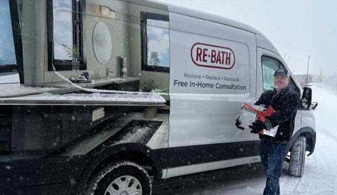 Great Lakes Home Renovations team member with service vehicle