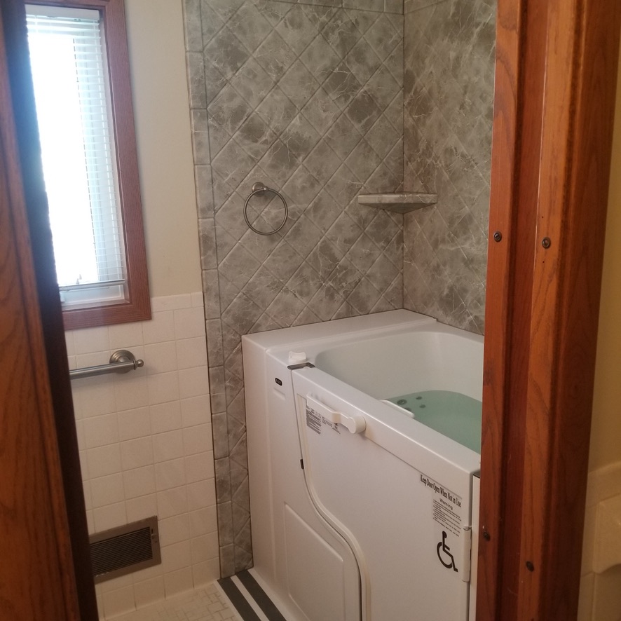 Walk-in Tub with Re-Bath Gray Emperador Surround