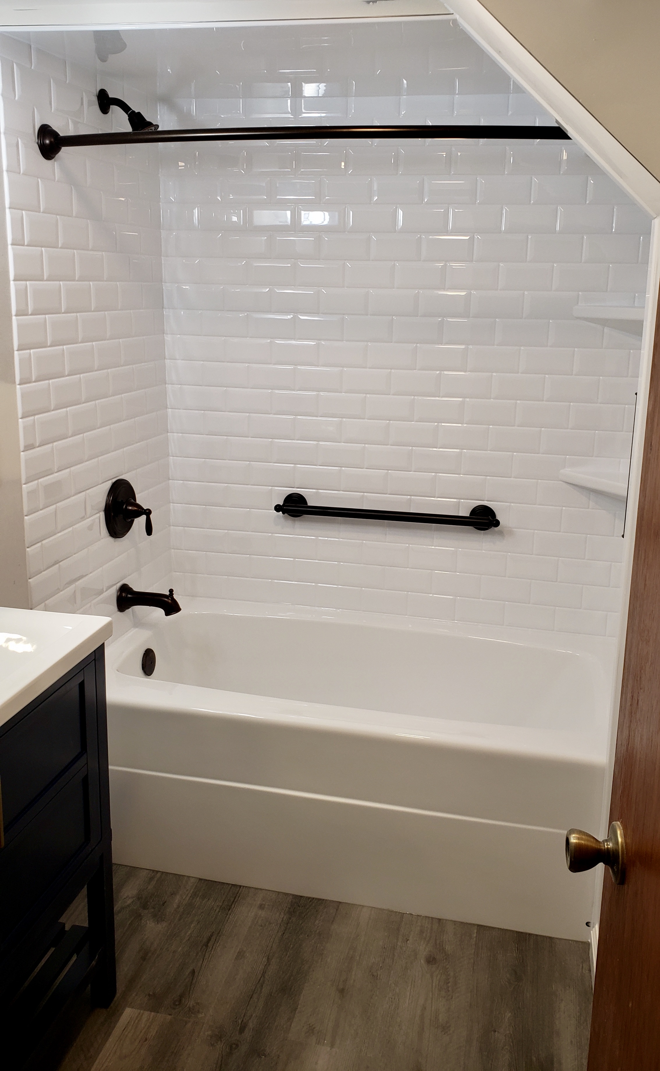 Bertch Vanity, MSI Flooring, White Subway Tile Bathtub Surround-black matte fixtures