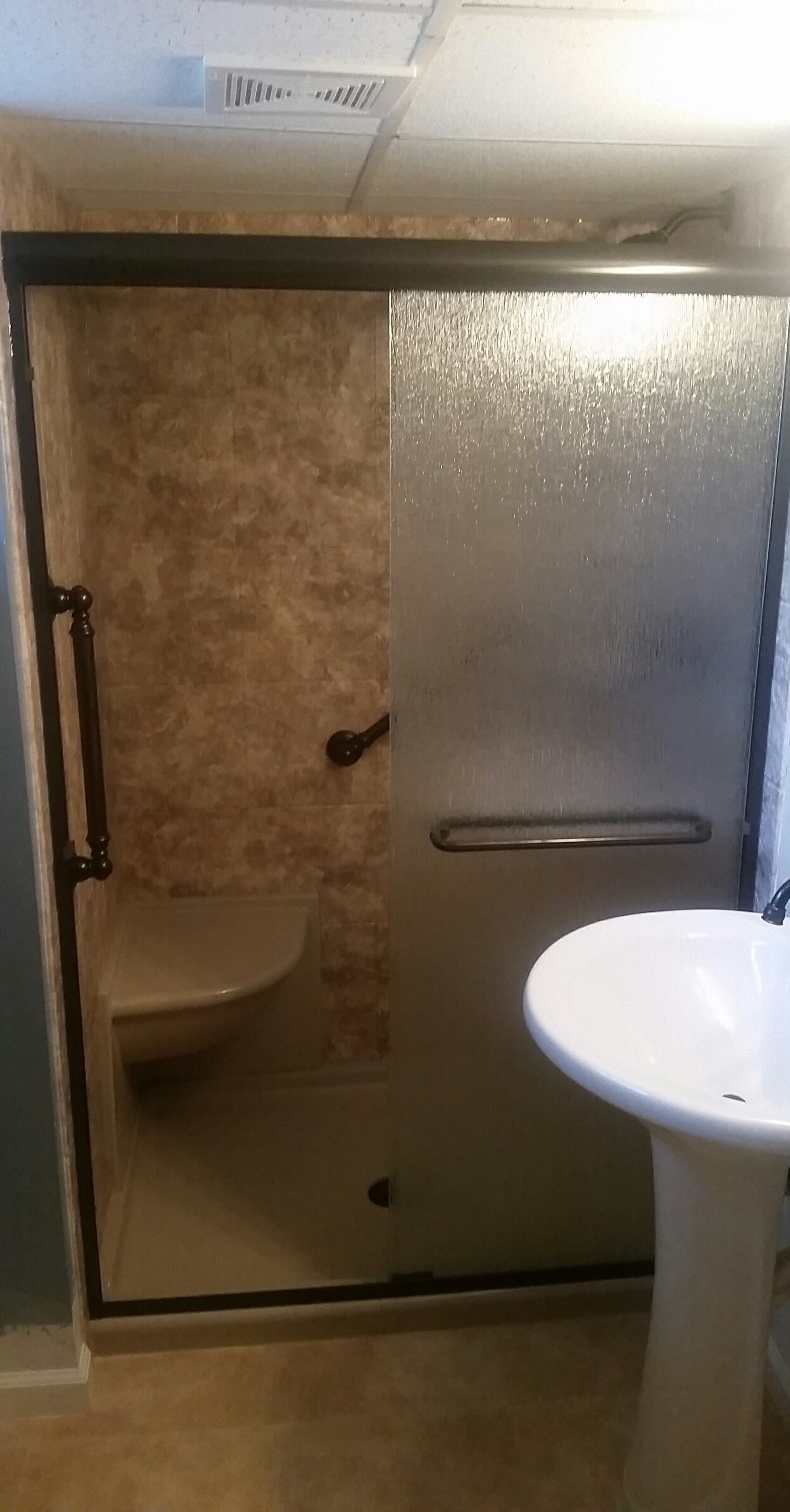 AFTER - New Acrylic Surround in River Rock 12x12 Slate pattern with Sandbar Shower Base and Seat