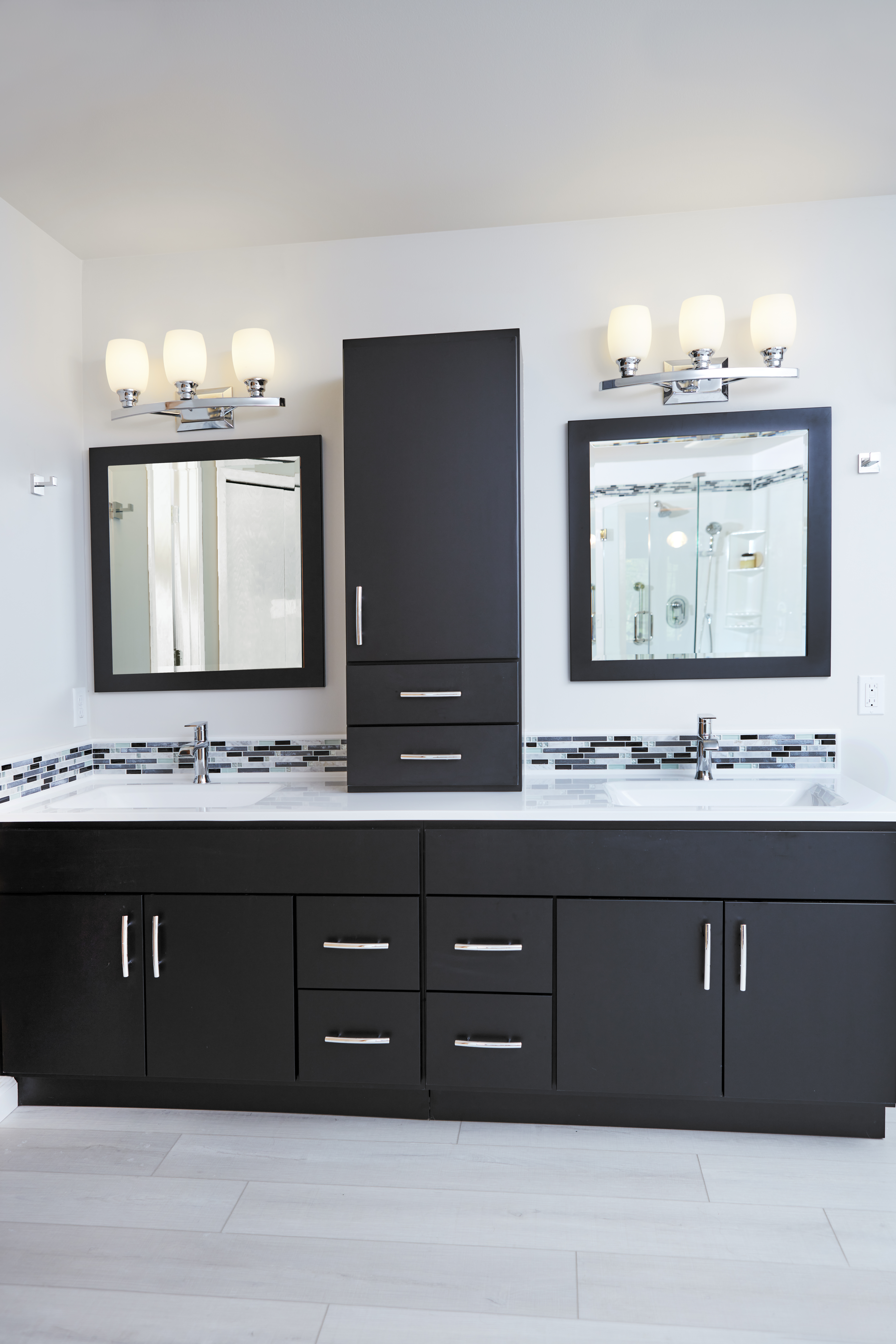 Bertch Black vanity with white Onyx vanity top and mosaic tile trim