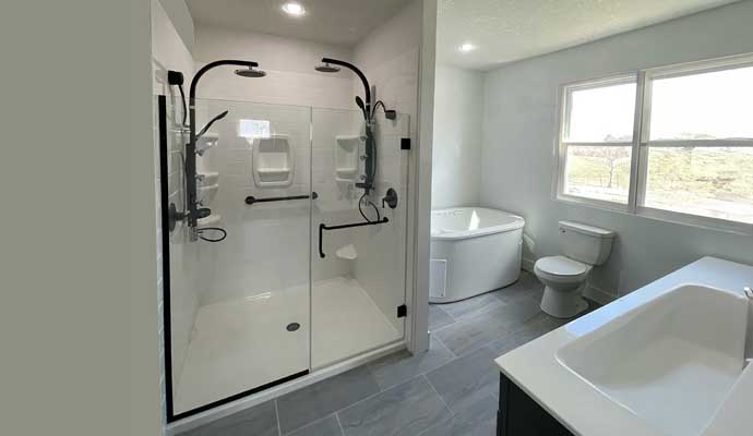 modern bathroom with glass shower and freestanding tub