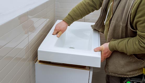 Professional expert installing vanity