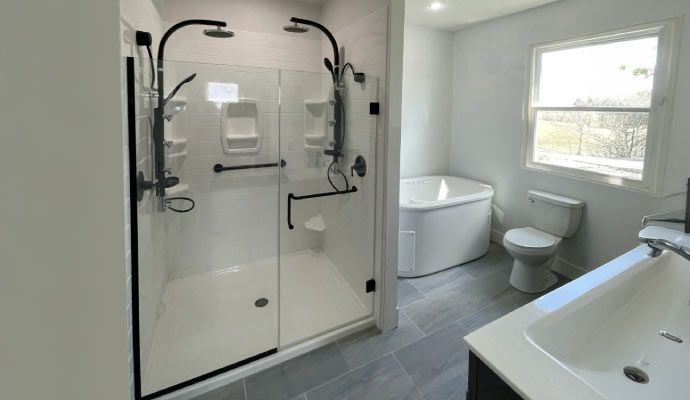 Stylish shower installation in remodeled bathroom Remodeled bathroom with newly installed glass shower enclosure