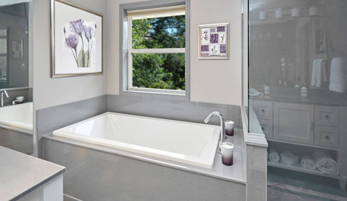 Bathroom with soaking tub and window