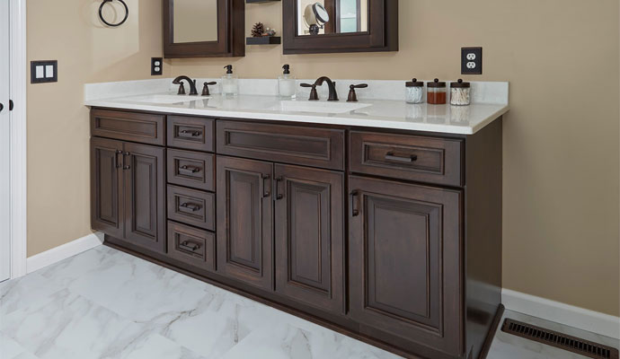 Double sink vanity with dark wood cabinets
