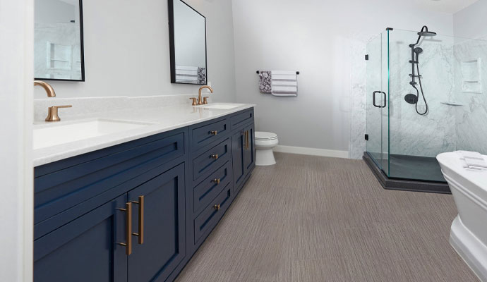 Luxury master bathroom with navy blue cabinets