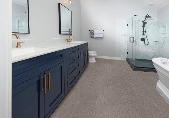 The stylish bathroom features dual sinks and a spacious shower