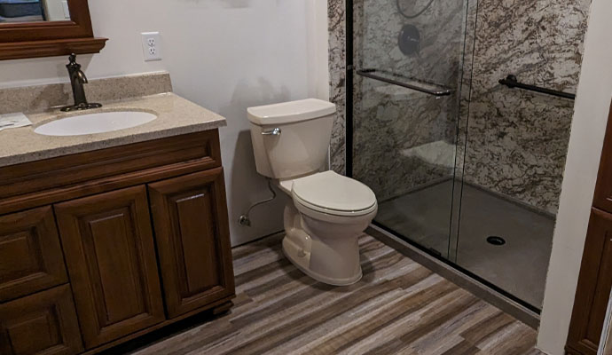 Traditional bathroom with wood vanity