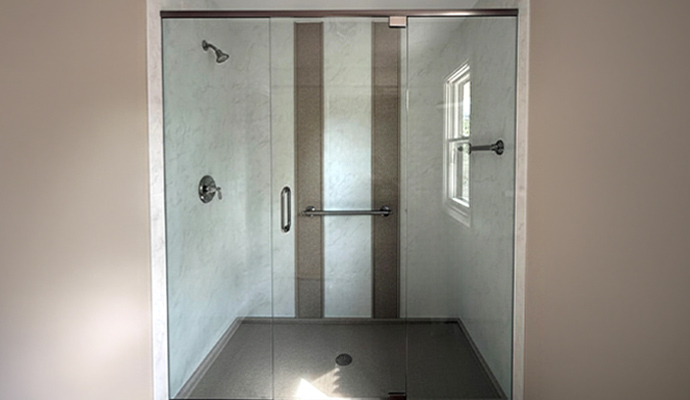 Custom acrylic walk-in shower installed in a residential bathroom