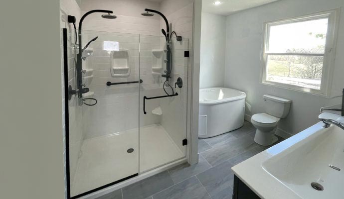 White bathroom with glass shower enclosure and tub